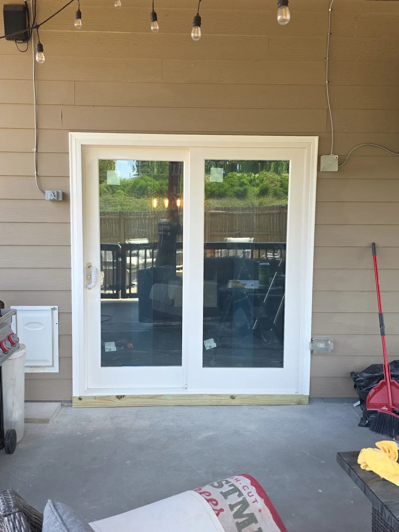 Finished sliding glass door installation with updated trim